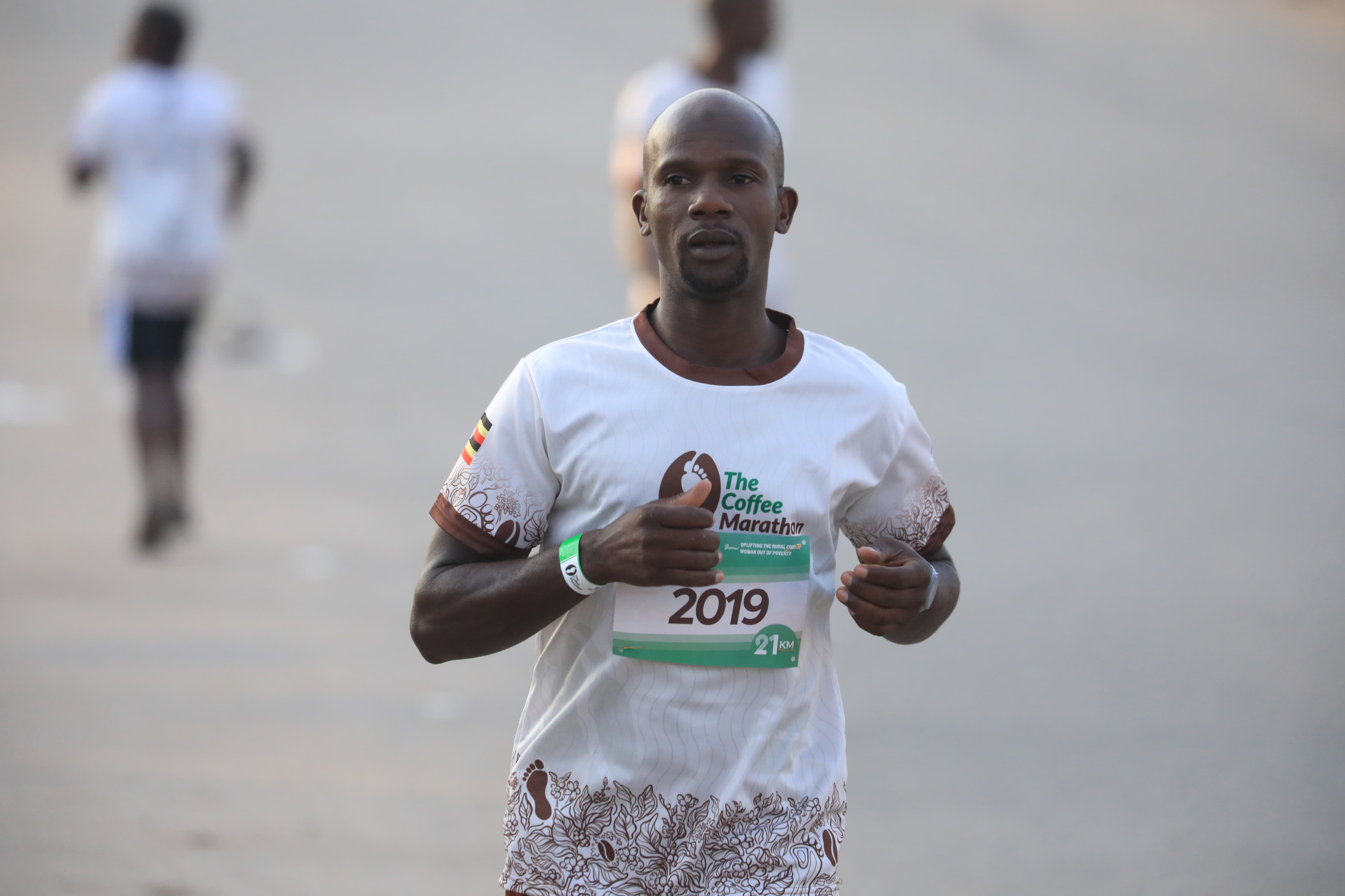 Elite 21 KM runner mid-race — Coffee Marathon 2025